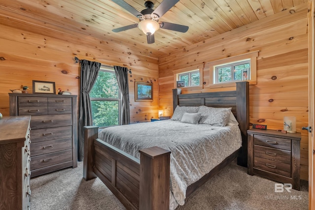 30857 Cypress St, Perdido Beach, AL 36530 - bedroom with carpet floors, wood walls, a ceiling fan, and wooden ceiling