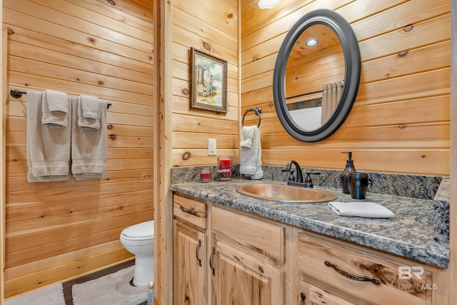 30857 Cypress St, Perdido Beach, AL 36530 - bathroom featuring wood walls and vanity