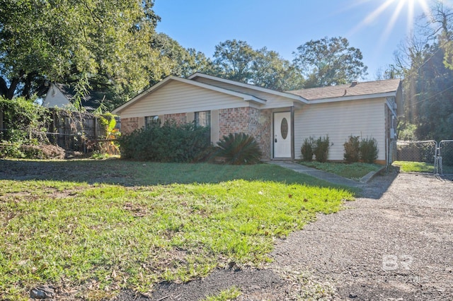 ranch-style house with a front yard