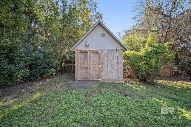 view of outdoor structure with a lawn