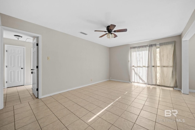 unfurnished room with ceiling fan and light tile patterned flooring