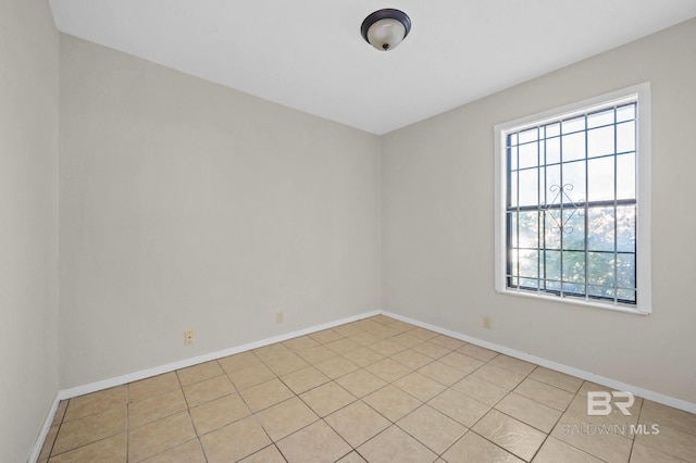 spare room with light tile patterned floors