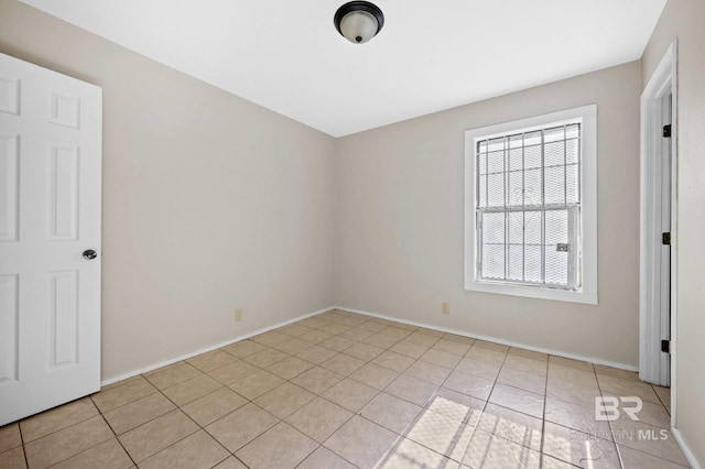 empty room featuring light tile patterned floors