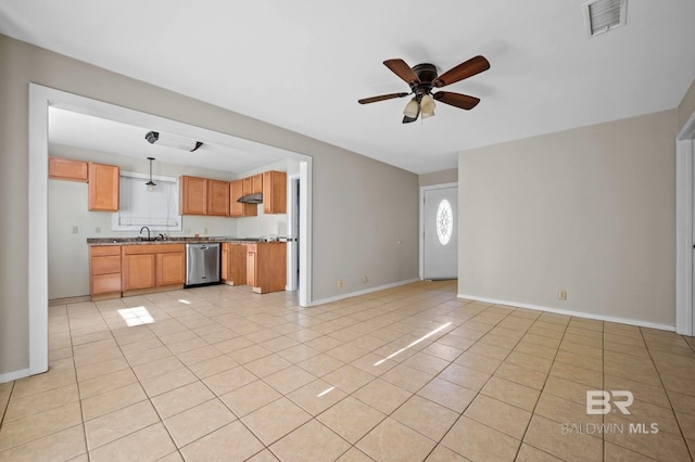 kitchen with ceiling fan, dishwasher, light tile patterned floors, and sink