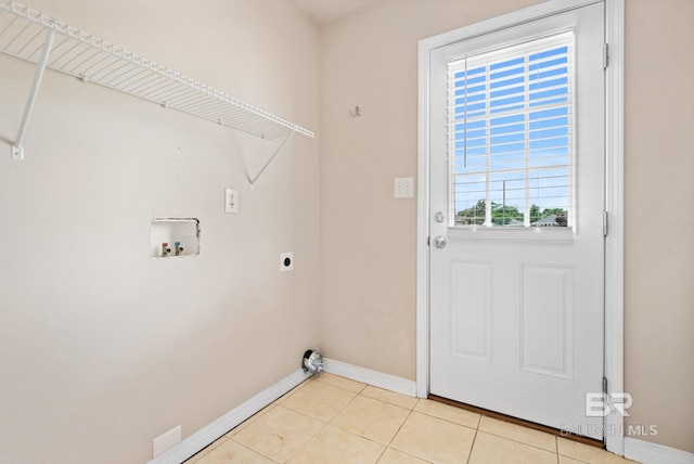 10966 Brighton Dr, Chunchula, AL 36521 - laundry area featuring hookup for an electric dryer, washer hookup, baseboards, and light tile patterned floors
