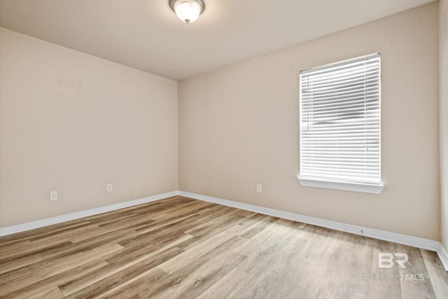 10966 Brighton Dr, Chunchula, AL 36521 - spare room featuring wood finished floors and baseboards