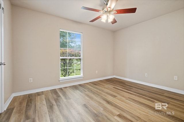 10966 Brighton Dr, Chunchula, AL 36521 - empty room with a ceiling fan, wood finished floors, and baseboards