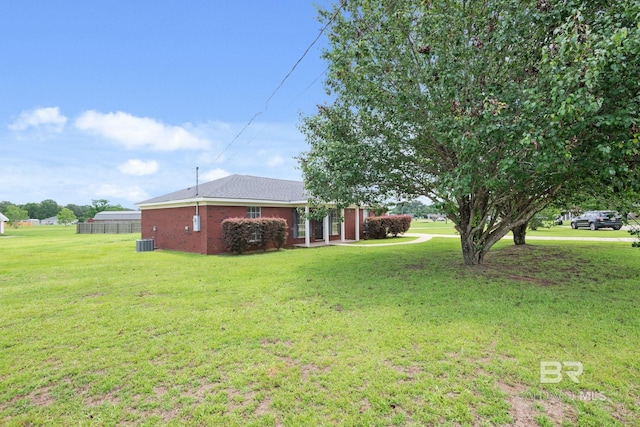 10966 Brighton Dr, Chunchula, AL 36521 - view of grassy yard with central AC unit