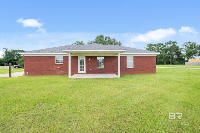 10966 Brighton Dr, Chunchula, AL 36521 - back of property featuring a patio area, a yard, and brick siding