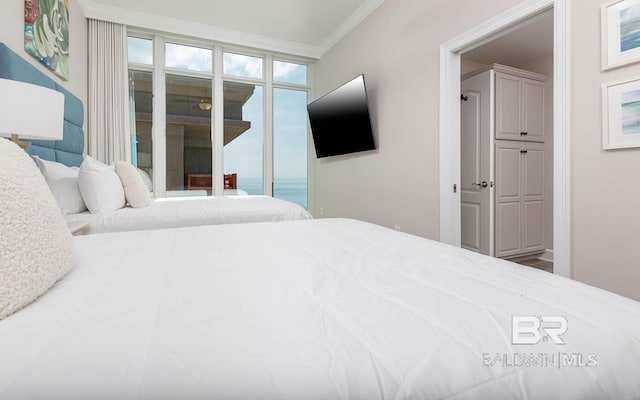 bedroom with crown molding