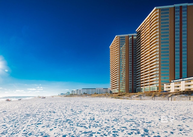 exterior space featuring a water view and a view of the beach