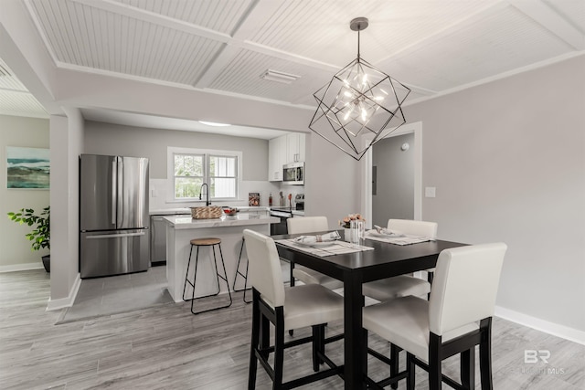 dining room featuring an inviting chandelier and light wood-type flooring