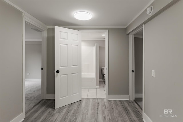 hall featuring crown molding and wood-type flooring