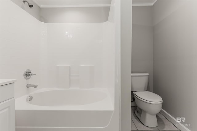 full bathroom featuring vanity, tile patterned floors, toilet, and washtub / shower combination