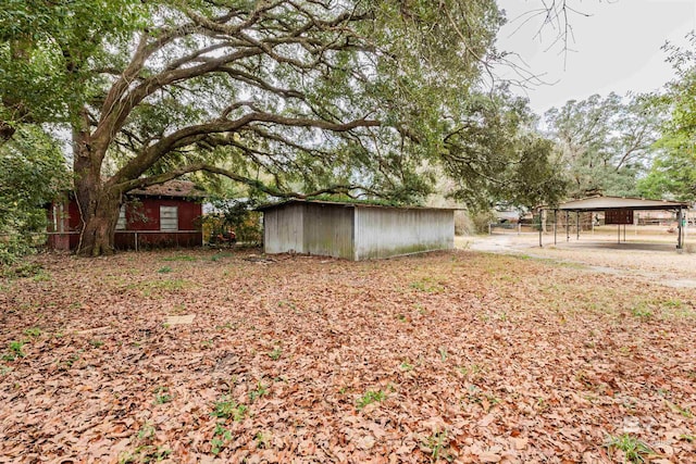 view of yard with a carport