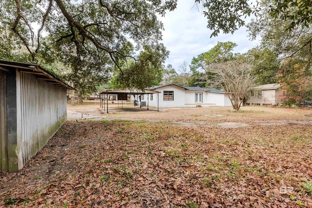 view of yard with a carport