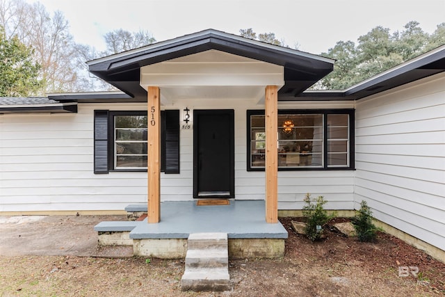 property entrance featuring covered porch