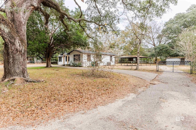 single story home featuring a carport