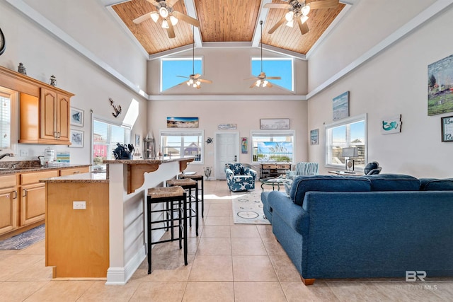 living room featuring wooden ceiling, light tile patterned floors, and a wealth of natural light