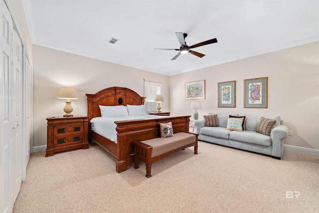 bedroom featuring visible vents, light carpet, and baseboards