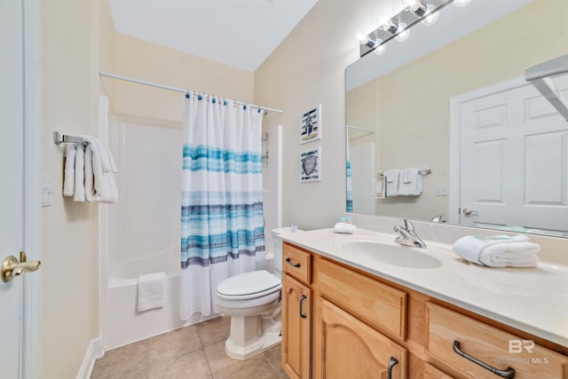 bathroom featuring tile patterned flooring, vanity, toilet, and shower / bath combo with shower curtain