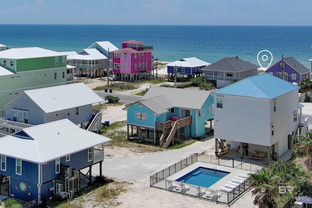 drone / aerial view featuring a water view and a residential view