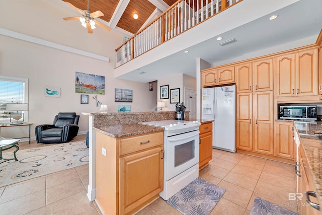 kitchen featuring light tile patterned floors, visible vents, open floor plan, high vaulted ceiling, and white appliances