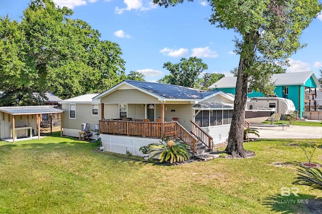 rear view of property featuring a yard