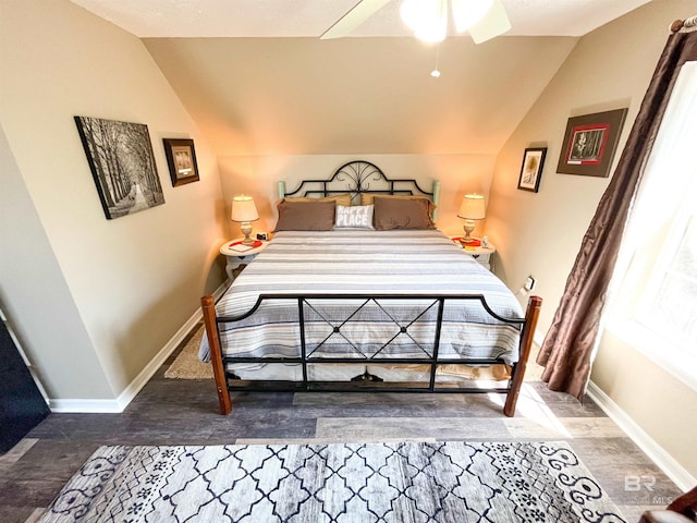 bedroom with wood-type flooring, ceiling fan, and lofted ceiling