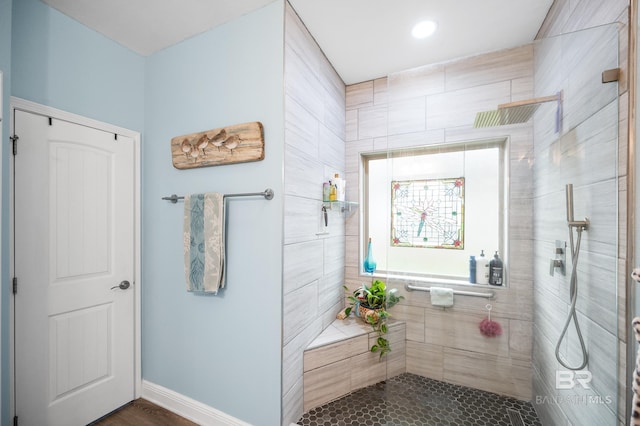 bathroom with tiled shower