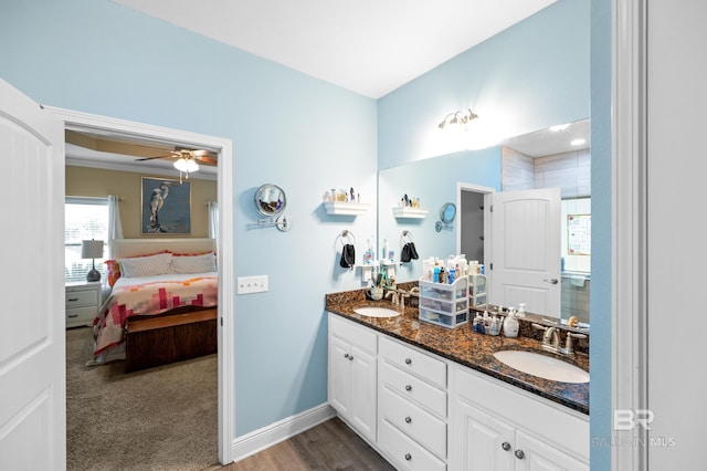 bathroom with vanity, ceiling fan, and wood-type flooring