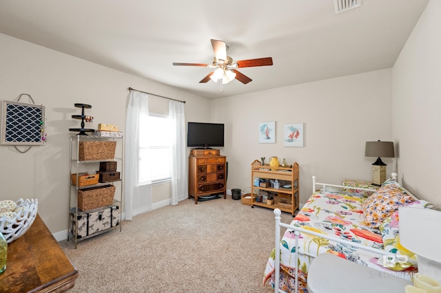 carpeted bedroom featuring ceiling fan