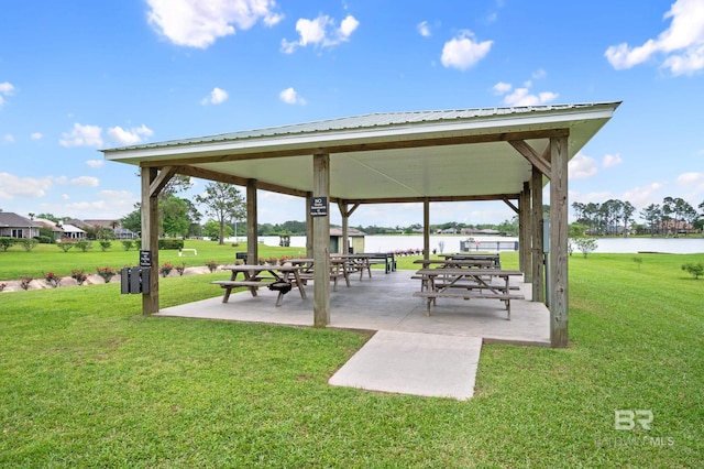 view of home's community featuring a gazebo, a patio area, a water view, and a lawn