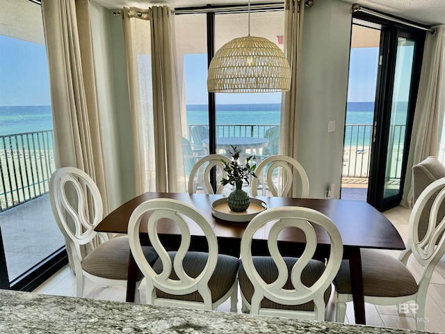 dining space with a water view