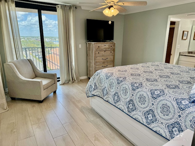 bedroom featuring access to outside, ceiling fan, light hardwood / wood-style floors, crown molding, and ensuite bath