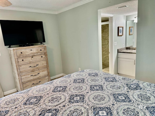 bedroom with ornamental molding, ensuite bathroom, and a textured ceiling