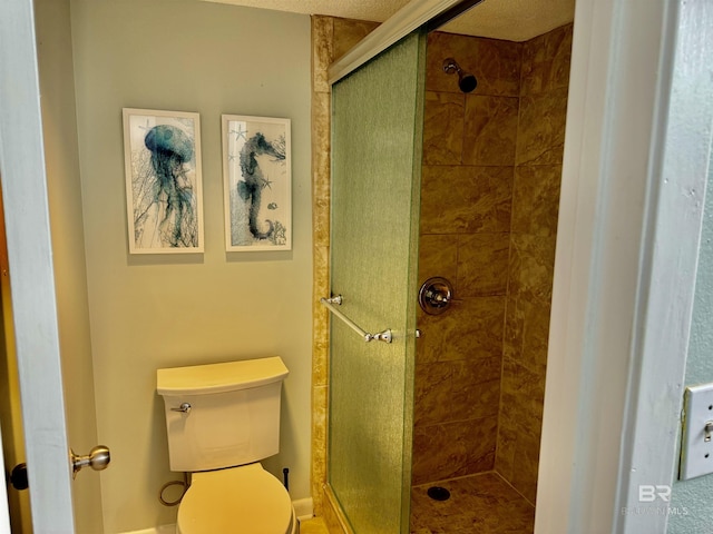 bathroom with walk in shower and toilet