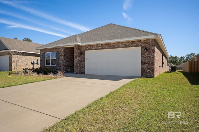 ranch-style house with brick siding, roof with shingles, a front yard, a garage, and driveway