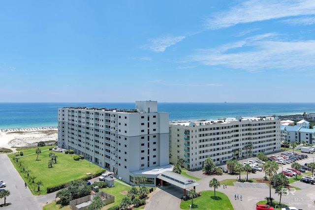 aerial view with a water view and a view of the beach