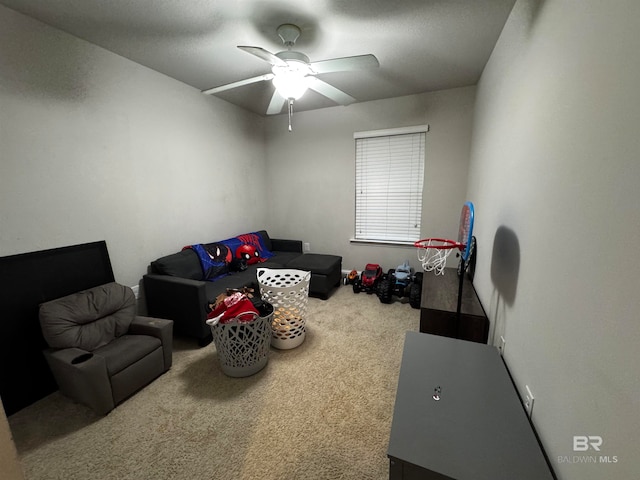 playroom featuring carpet and ceiling fan