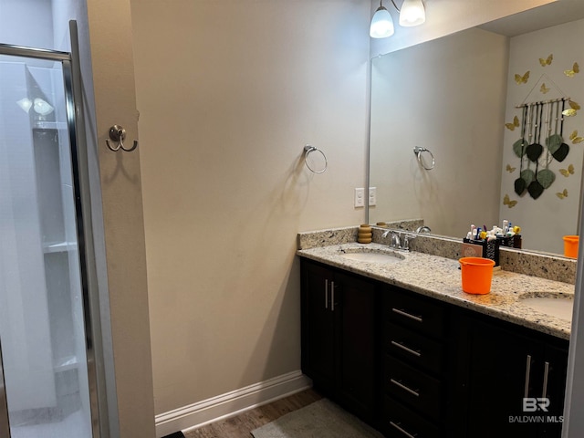 bathroom featuring vanity and wood-type flooring