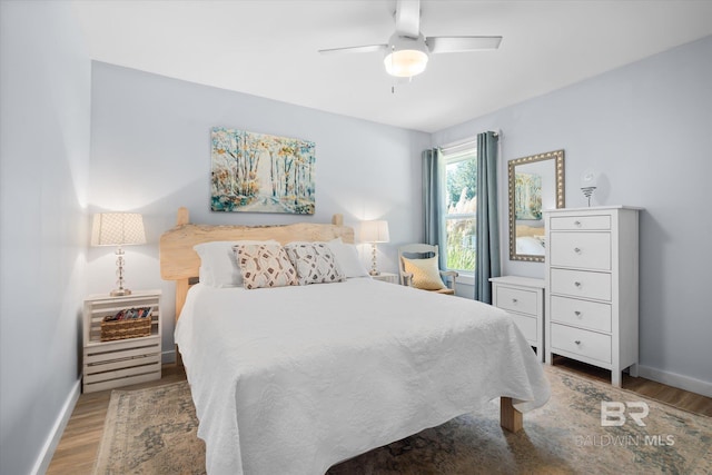 bedroom featuring hardwood / wood-style floors and ceiling fan