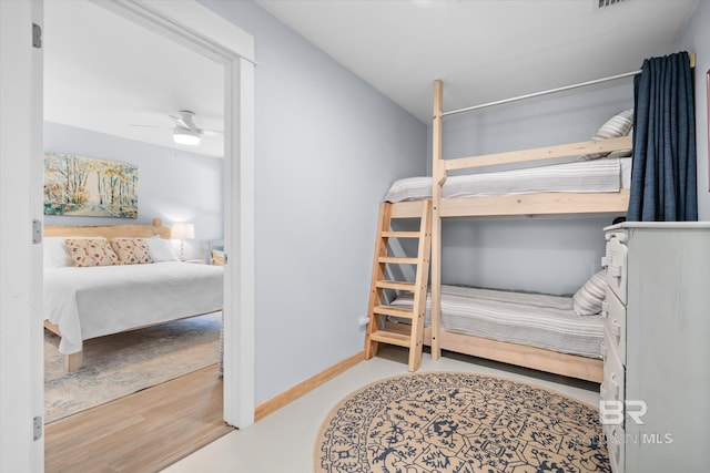 bedroom with hardwood / wood-style floors and ceiling fan