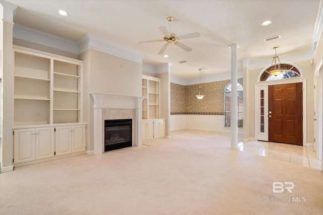 unfurnished living room with crown molding, recessed lighting, light colored carpet, visible vents, and a tile fireplace