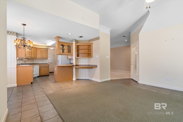 kitchen with a chandelier, open shelves, white appliances, and light tile patterned floors