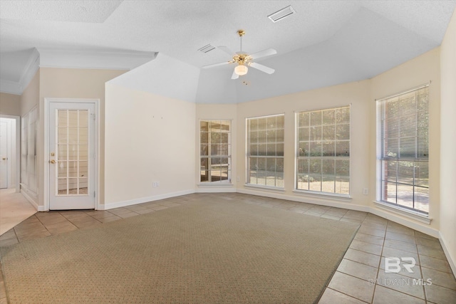 unfurnished room featuring baseboards, visible vents, ceiling fan, tile patterned floors, and a textured ceiling