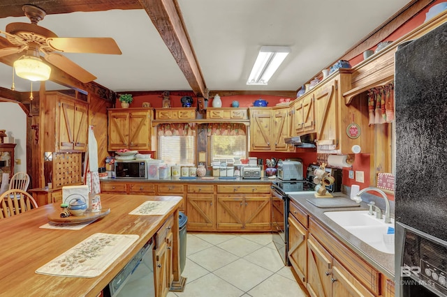 kitchen featuring sink, ceiling fan, appliances with stainless steel finishes, light tile patterned flooring, and beamed ceiling