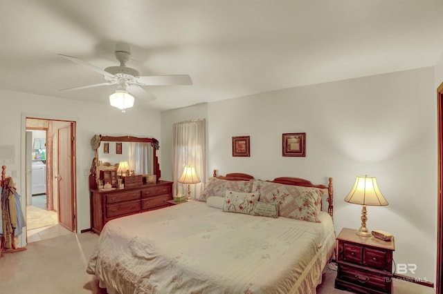 carpeted bedroom with washer / dryer and ceiling fan