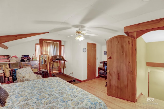 bedroom featuring lofted ceiling, ceiling fan, and light hardwood / wood-style flooring