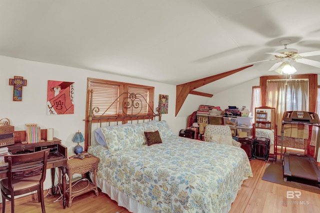 bedroom featuring lofted ceiling, ceiling fan, and light wood-type flooring